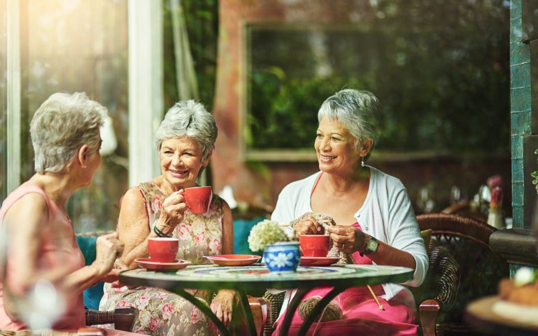 Elderly women drinking a hot drink