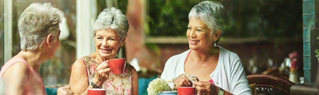 Elderly women drinking a hot drink