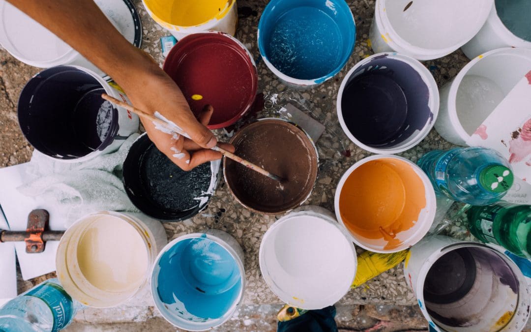 Open paint pots in various colours