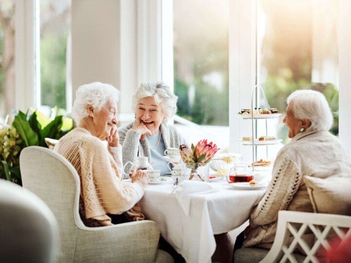 Elderly women having afternoon tea